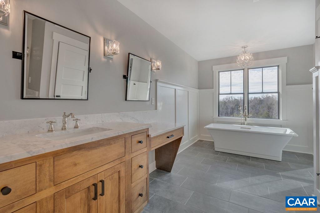 5797 Advance Mills Road Ruckersville, VA 22968 - Photo 28 of 50 a bathroom with a tub sink and mirror