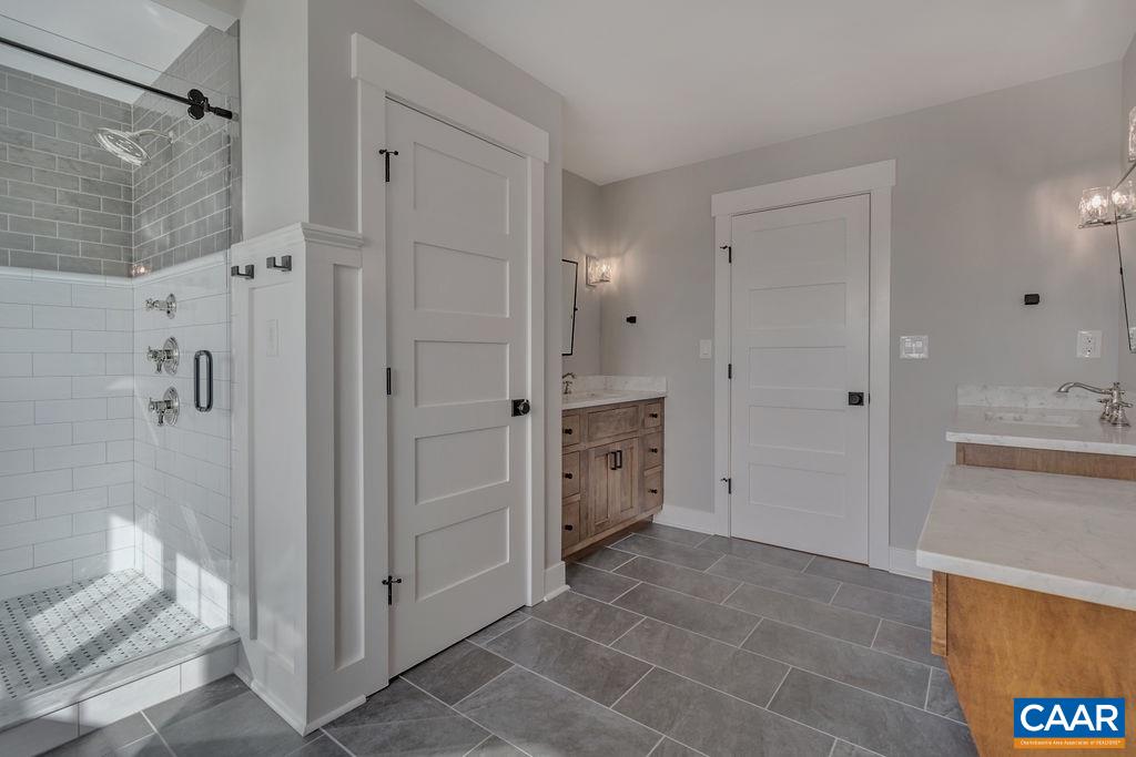 5797 Advance Mills Road Ruckersville, VA 22968 - Photo 29 of 50 a bathroom with a shower and a sink