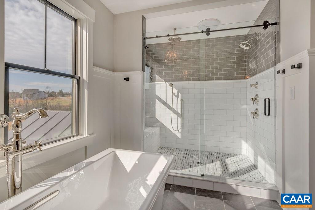 5797 Advance Mills Road Ruckersville, VA 22968 - Photo 30 of 50 a bathroom with a bathtub and a shower