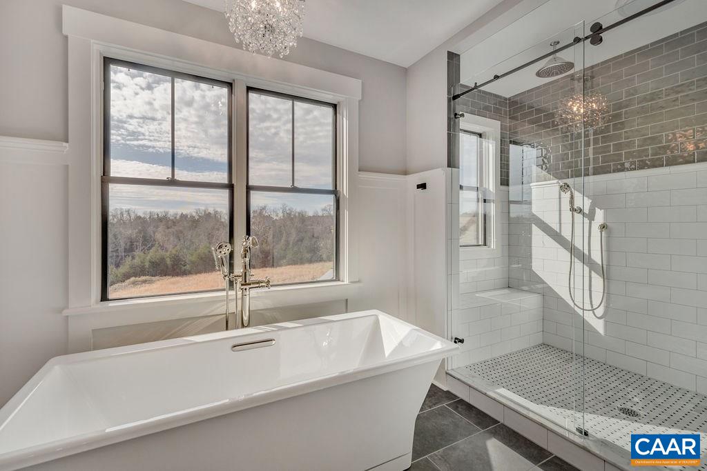 5797 Advance Mills Road Ruckersville, VA 22968 - Photo 32 of 50 a bathroom with a bathtub and a shower