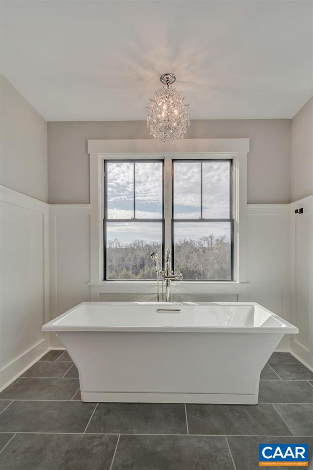 5797 Advance Mills Road Ruckersville, VA 22968 - Photo 33 of 50 a view of wooden floor and a chandelier fan