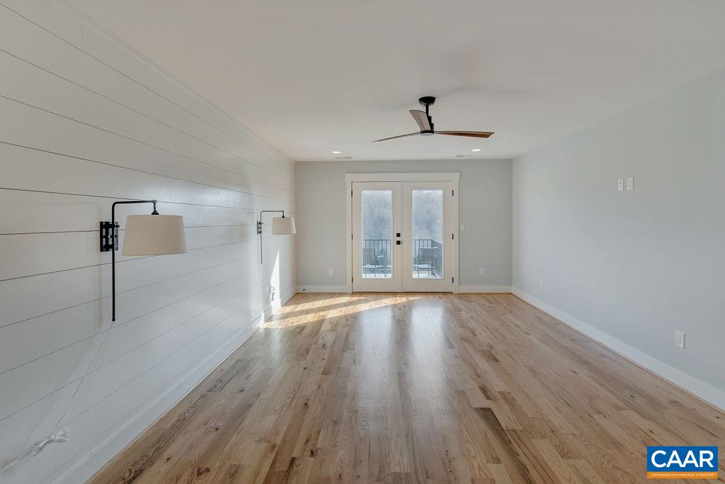 5797 Advance Mills Road Ruckersville, VA 22968 - Photo 34 of 50 a view of an empty room with wooden floor and a window