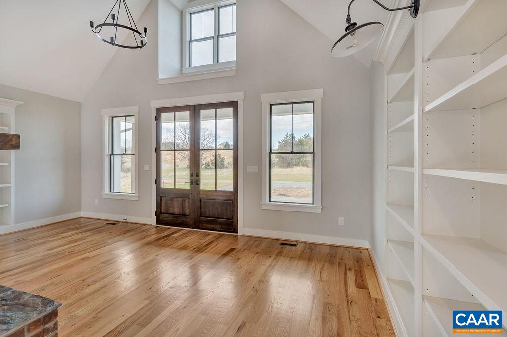5797 Advance Mills Road Ruckersville, VA 22968 - Photo 4 of 50 a view of an empty room with a window and wooden floor