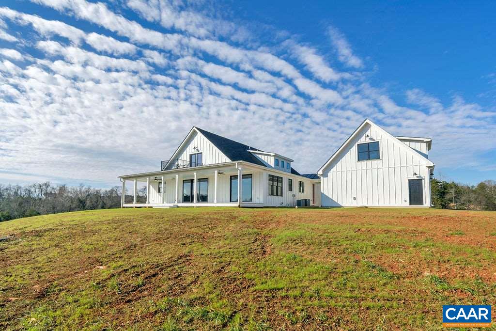 5797 Advance Mills Road Ruckersville, VA 22968 - Photo 41 of 50 a front view of a house with a garden