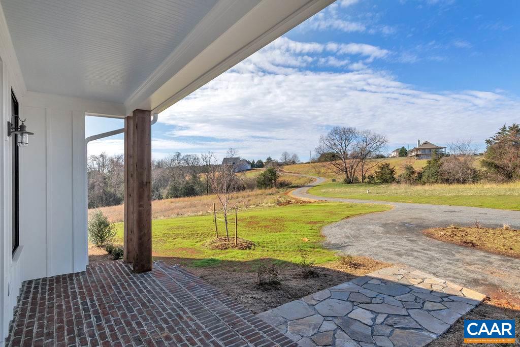 5797 Advance Mills Road Ruckersville, VA 22968 - Photo 44 of 50 a view of a swimming pool with an outdoor space and seating area