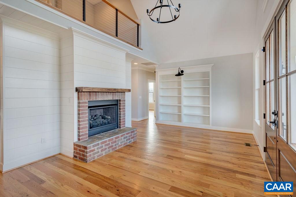 5797 Advance Mills Road Ruckersville, VA 22968 - Photo 5 of 50 a view of an empty room with a fireplace and a window