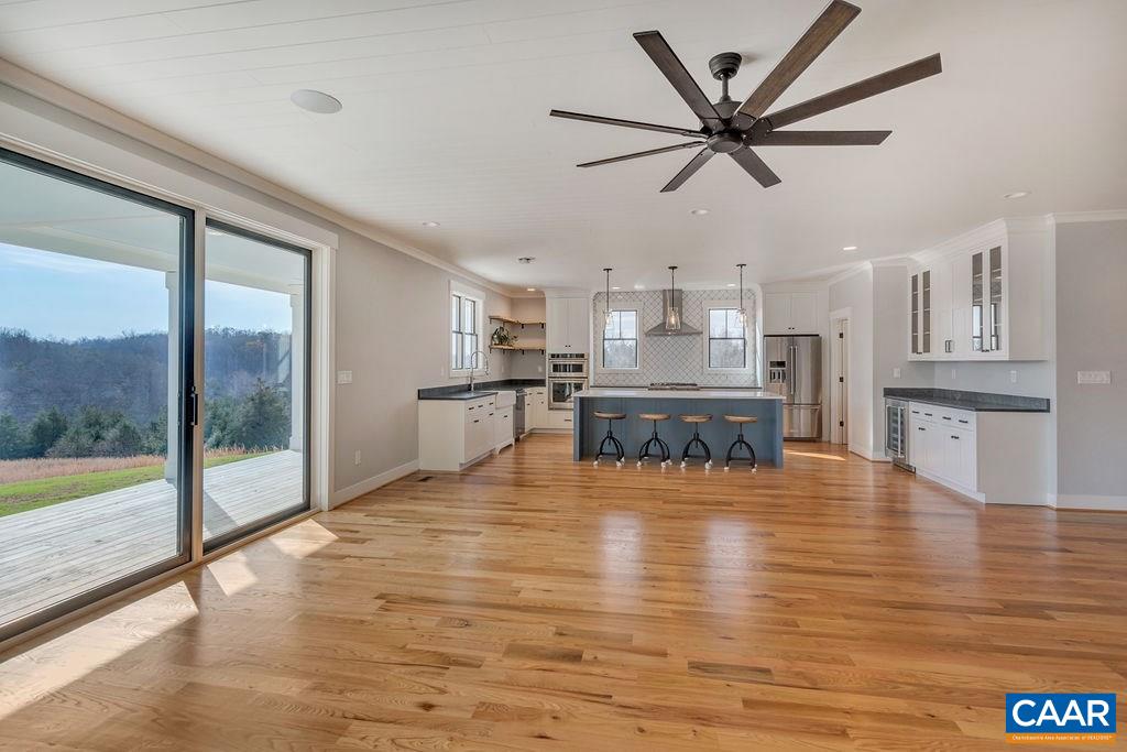 5797 Advance Mills Road Ruckersville, VA 22968 - Photo 8 of 50 a living room with stainless steel appliances furniture and a large window