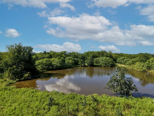 a view of a lake with a yard