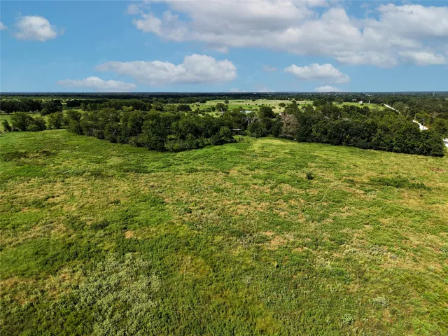 a view of a yard and an ocean