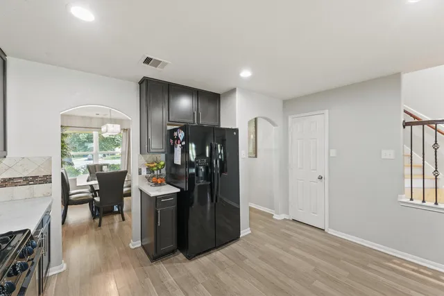 a view of a kitchen and dining room