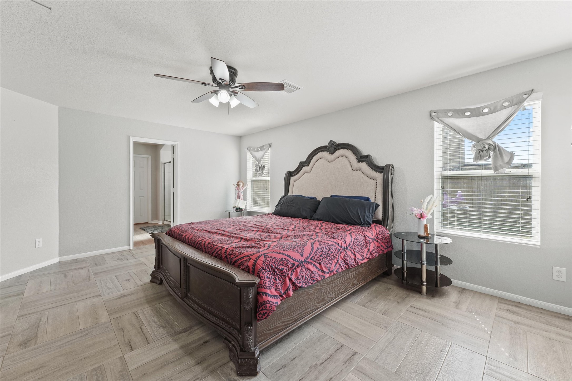 15307 Meandering Post Trail Houston, TX 77044 - Photo 13 of 25 a bedroom with a bed and window