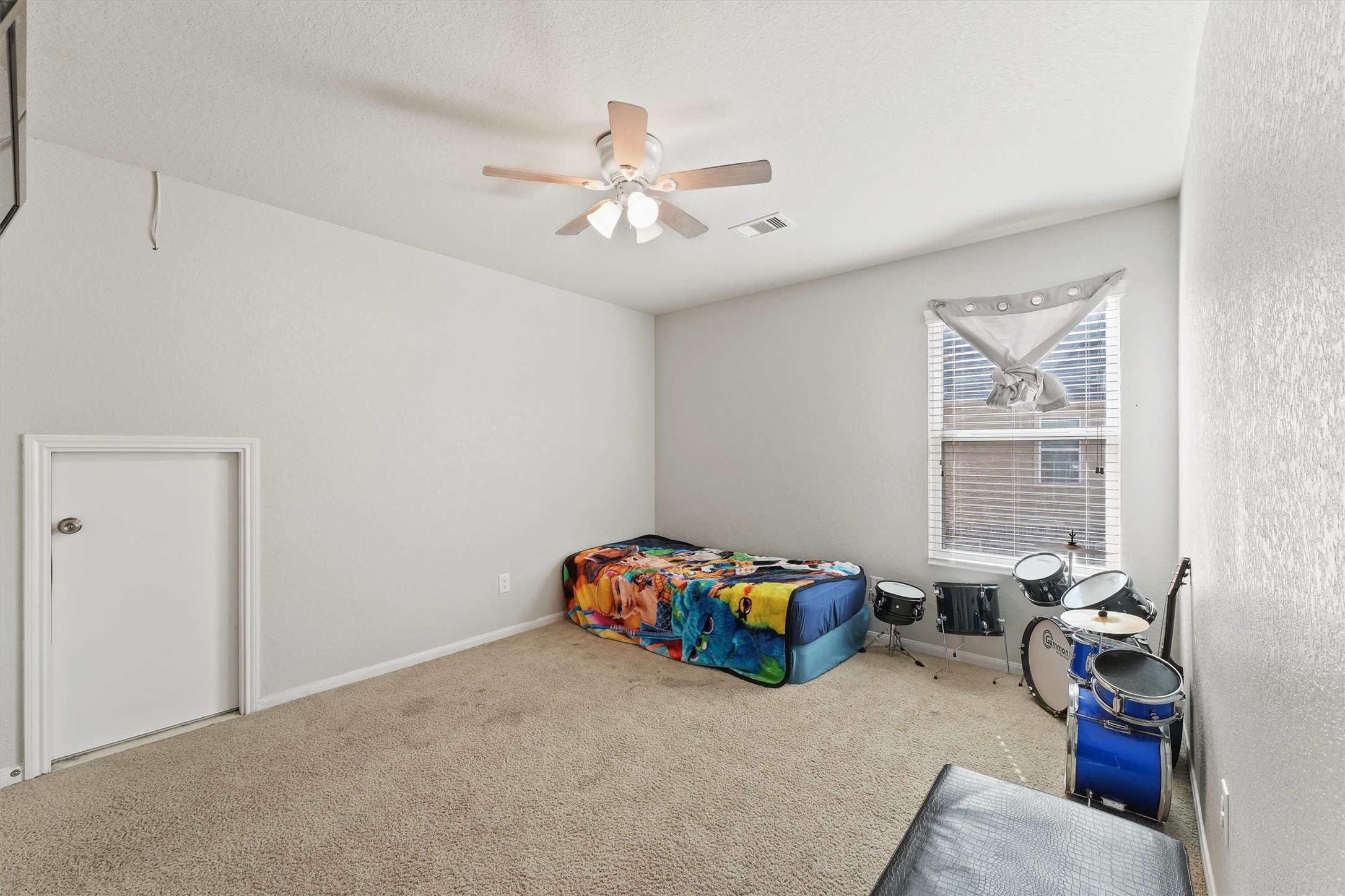 15307 Meandering Post Trail Houston, TX 77044 - Photo 18 of 25 a bedroom with a bed and wooden floor