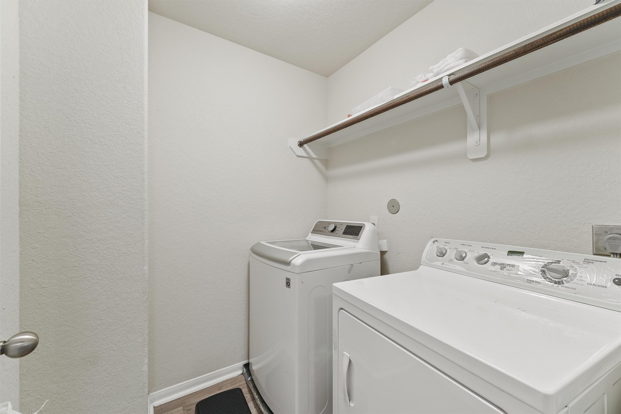 15307 Meandering Post Trail Houston, TX 77044 - Photo 22 of 25 a utility room with dryer and washer