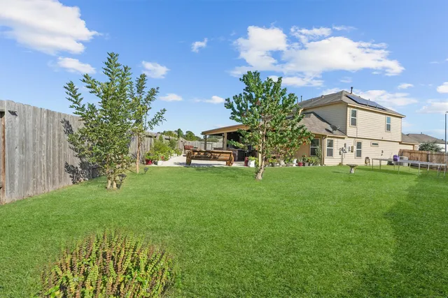 a view of a house with a back yard
