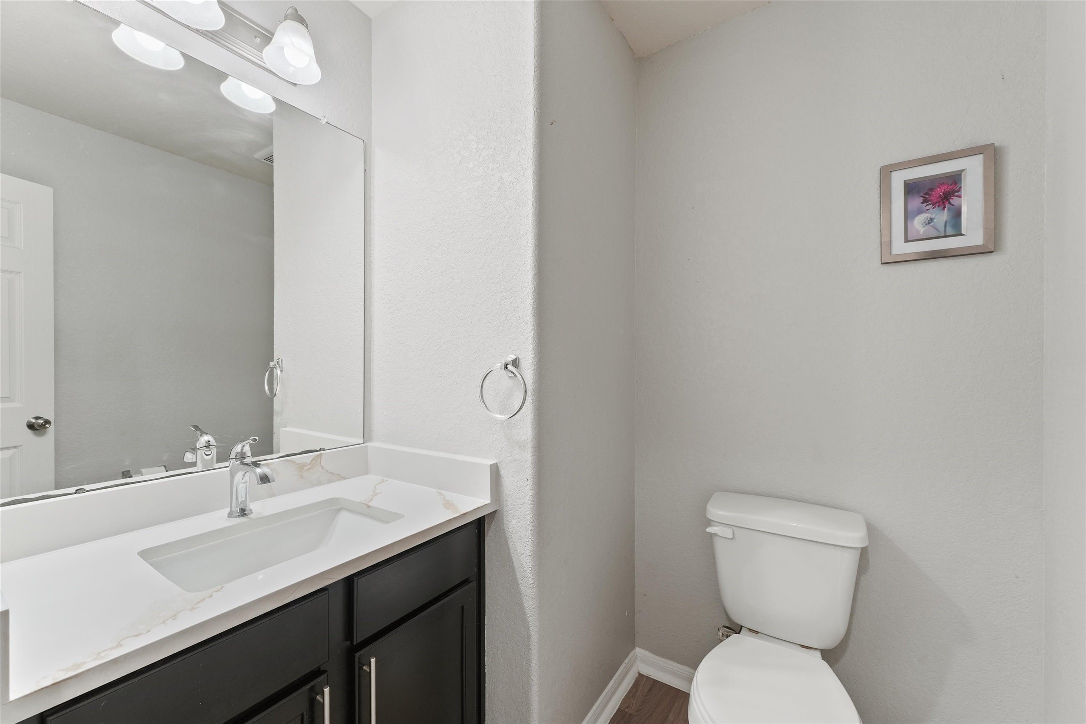 15307 Meandering Post Trail Houston, TX 77044 - Photo 7 of 25 a bathroom with a toilet sink and mirror