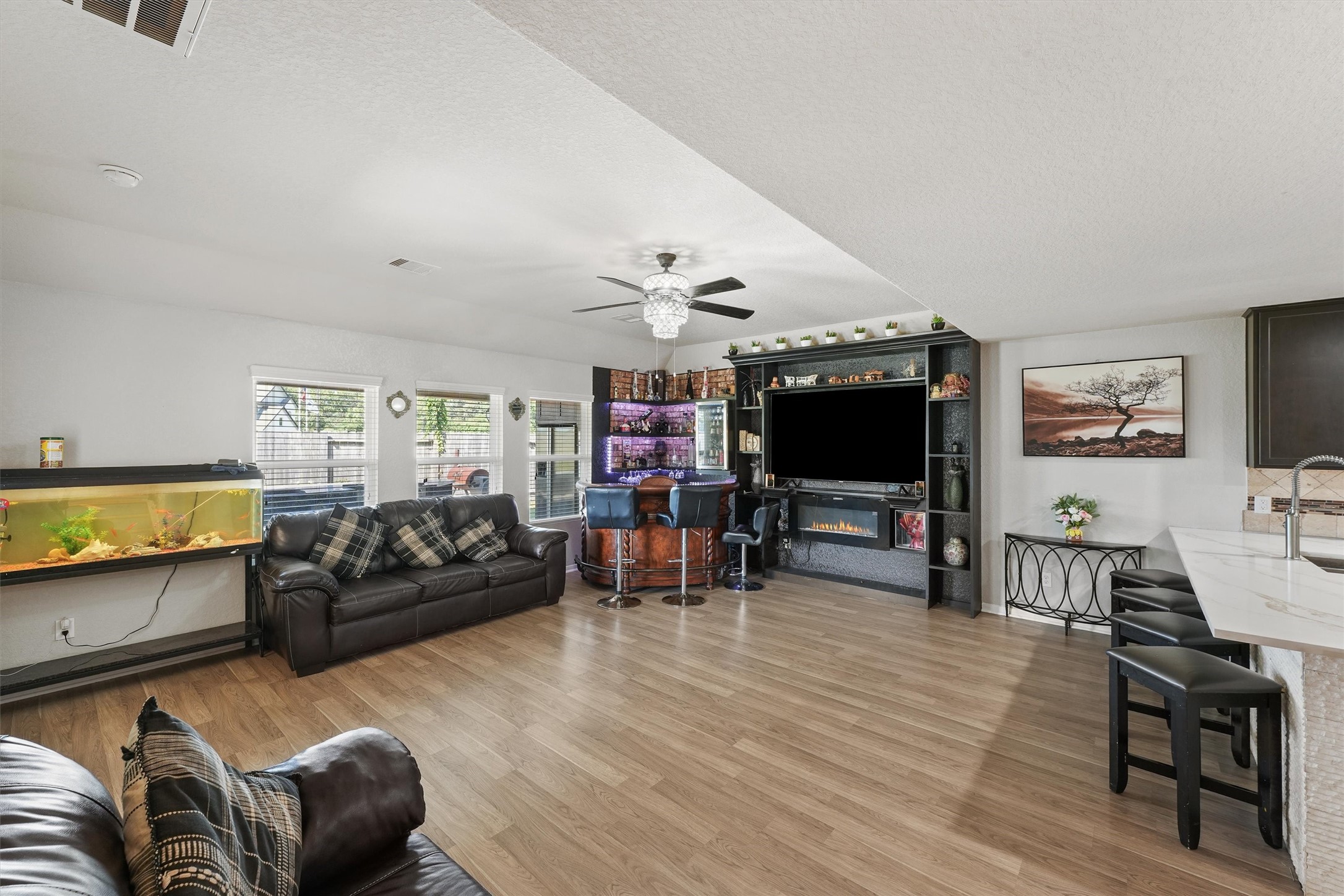 15307 Meandering Post Trail Houston, TX 77044 - Photo 8 of 25 a living room with furniture and a flat screen tv