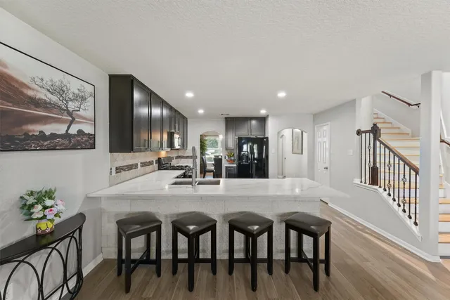 a dining area with furniture and view kitchen