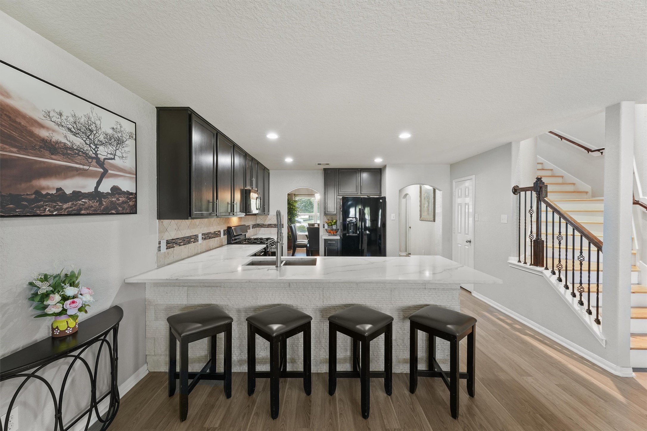 15307 Meandering Post Trail Houston, TX 77044 - Photo 10 of 25 a dining area with furniture and view kitchen