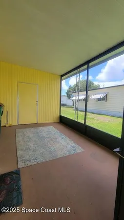 view of an empty room with a window