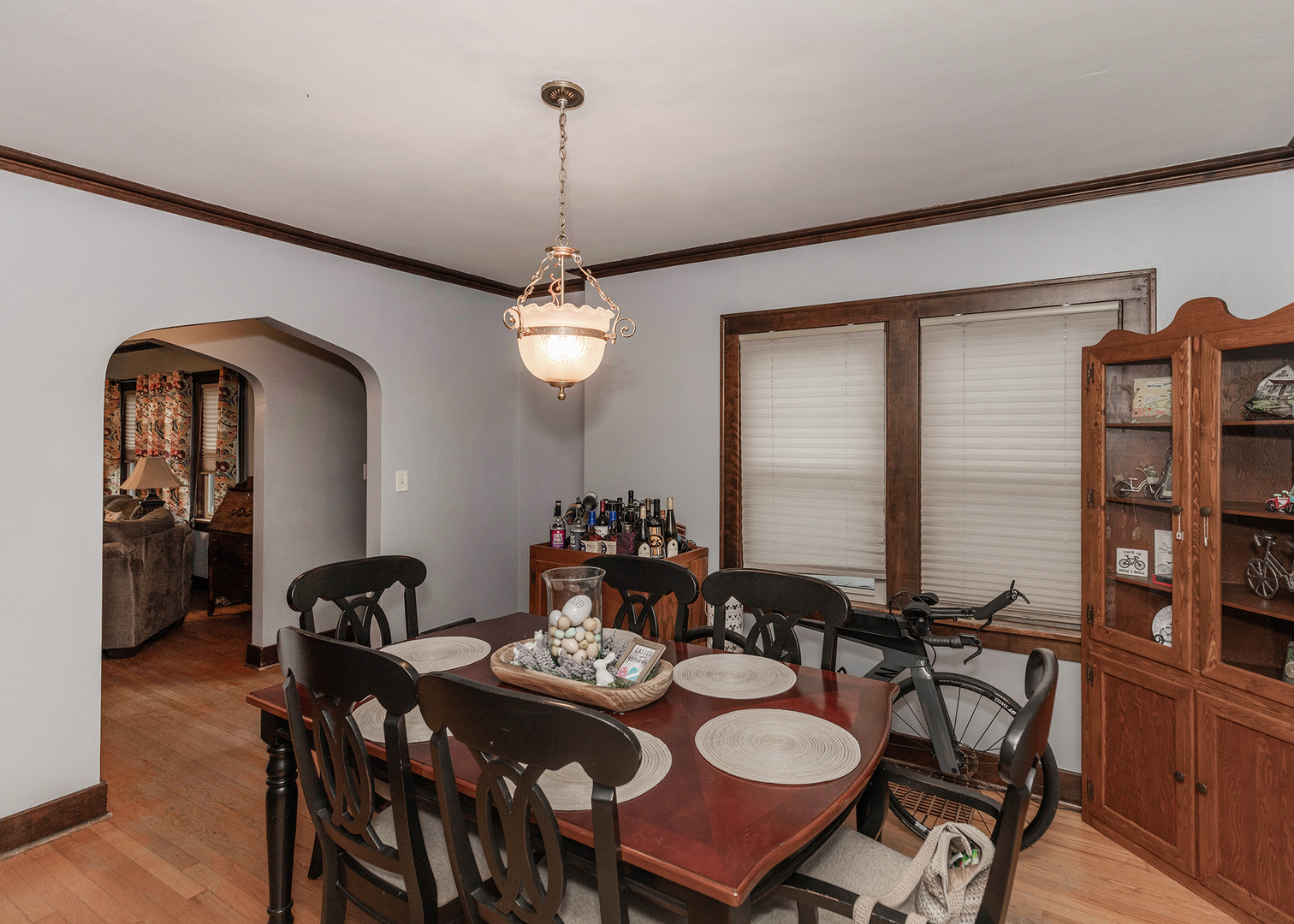 1125 17th Avenue Moline, IL 61265 - Photo 15 of 33 a view of a dining room and livingroom with furniture wooden floor a chandelier
