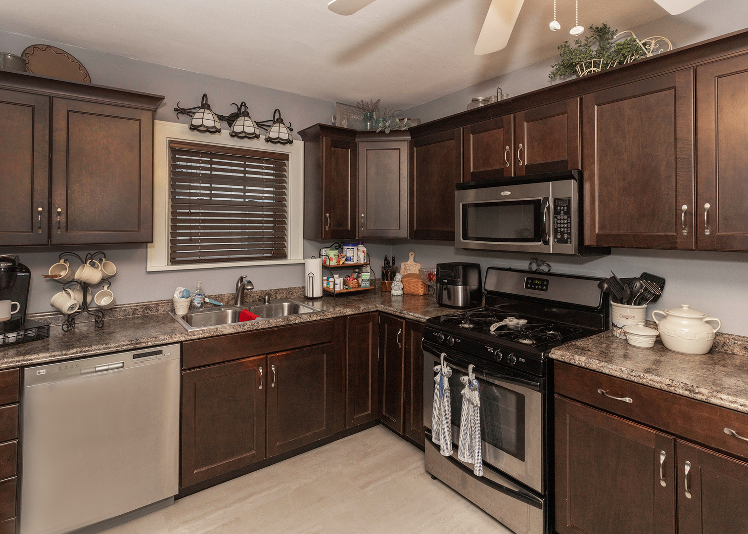 1125 17th Avenue Moline, IL 61265 - Photo 18 of 33 a kitchen with a sink stove and microwave