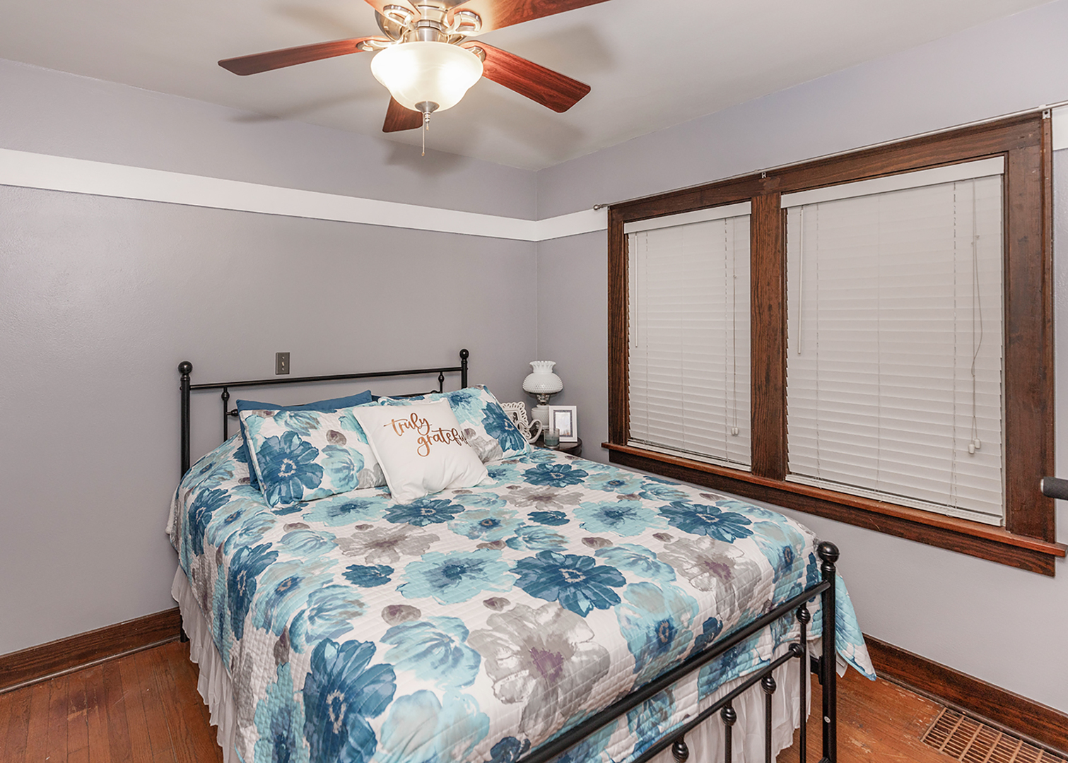 1125 17th Avenue Moline, IL 61265 - Photo 20 of 33 a bedroom with a large bed and a chandelier