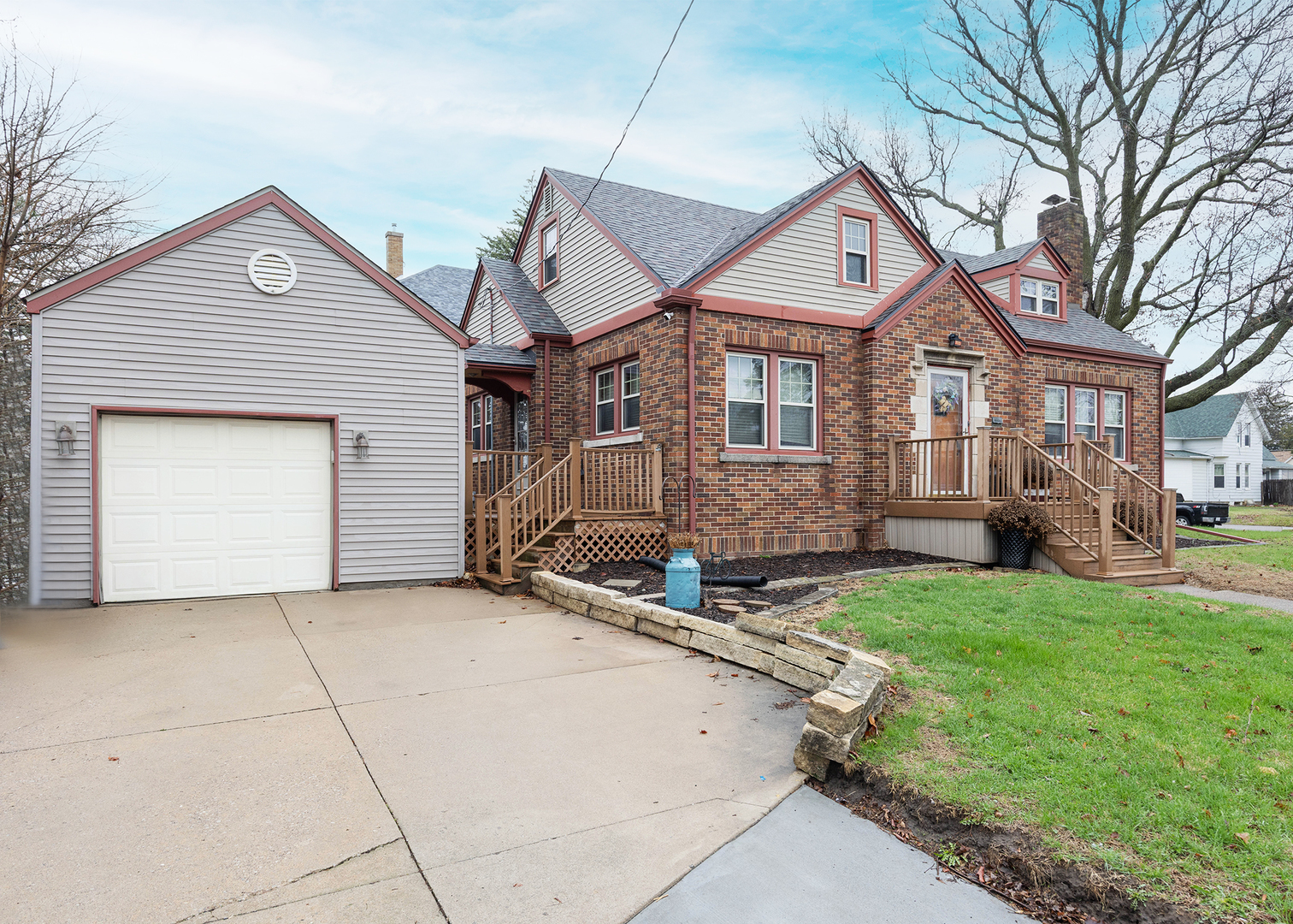 1125 17th Avenue Moline, IL 61265 - Photo 2 of 33 a front view of a house with a yard and garage