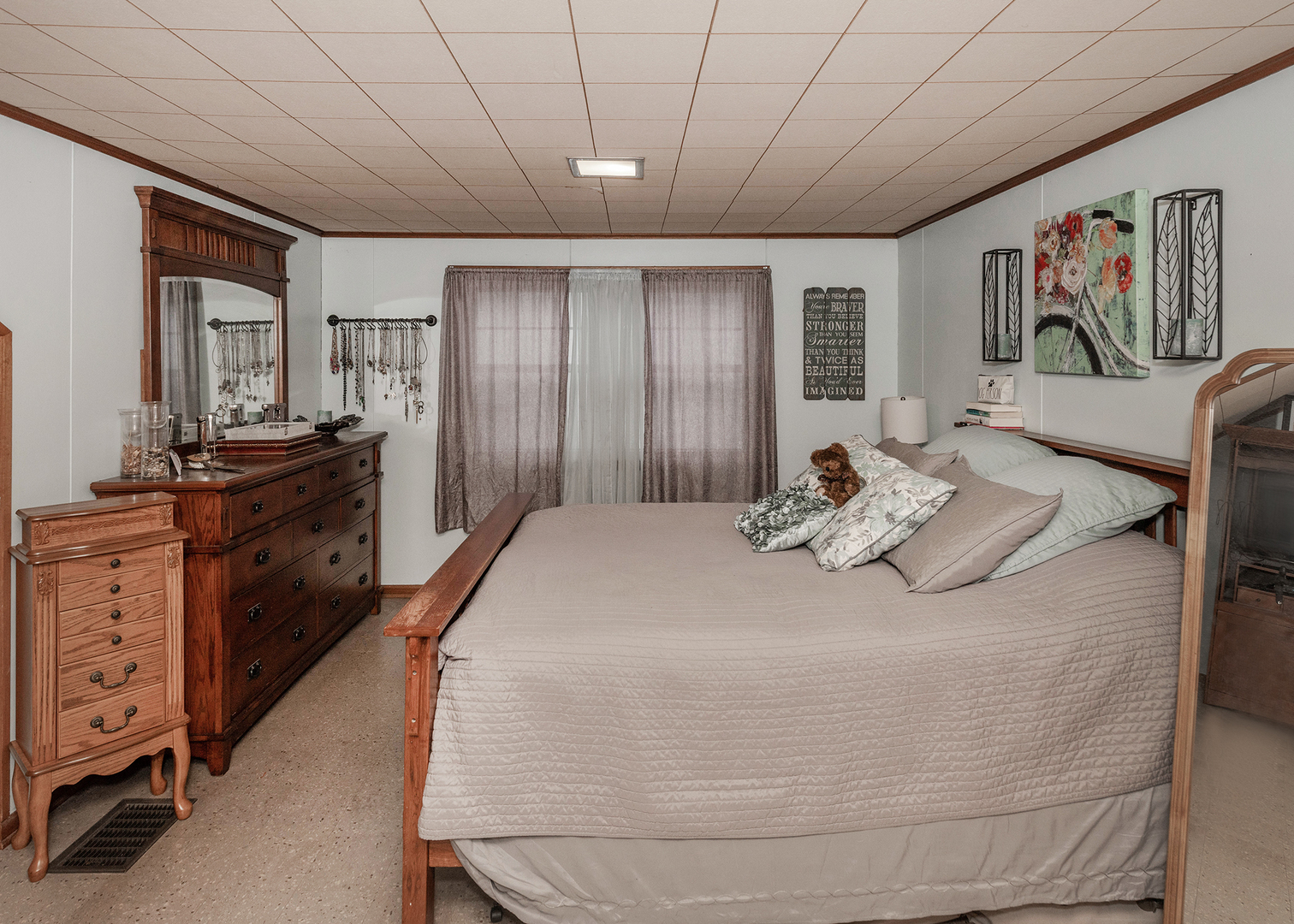 1125 17th Avenue Moline, IL 61265 - Photo 26 of 33 a bed sitting in a spacious bedroom next to a cabinet