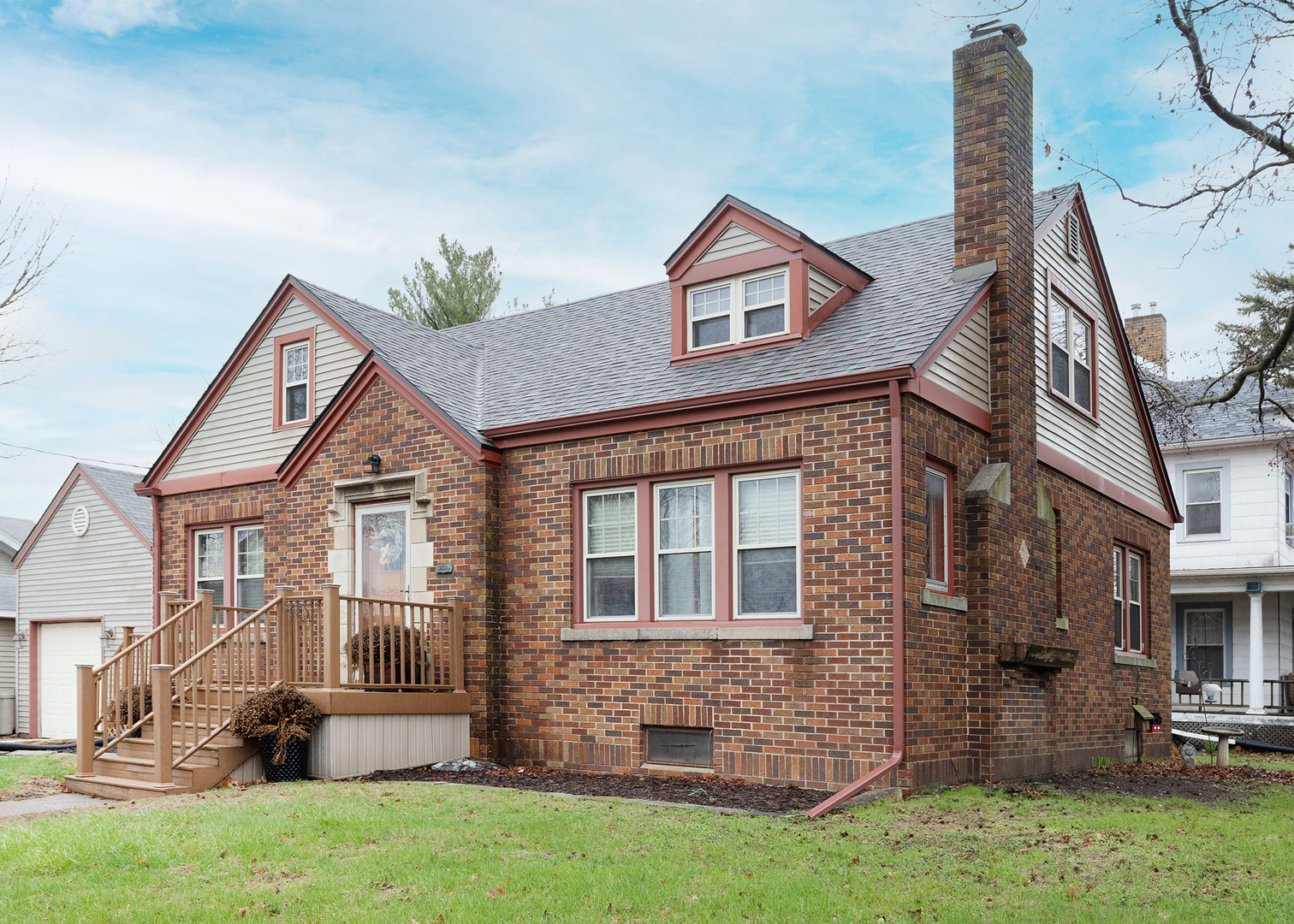1125 17th Avenue Moline, IL 61265 - Photo 3 of 33 a front view of a house with a yard and garage