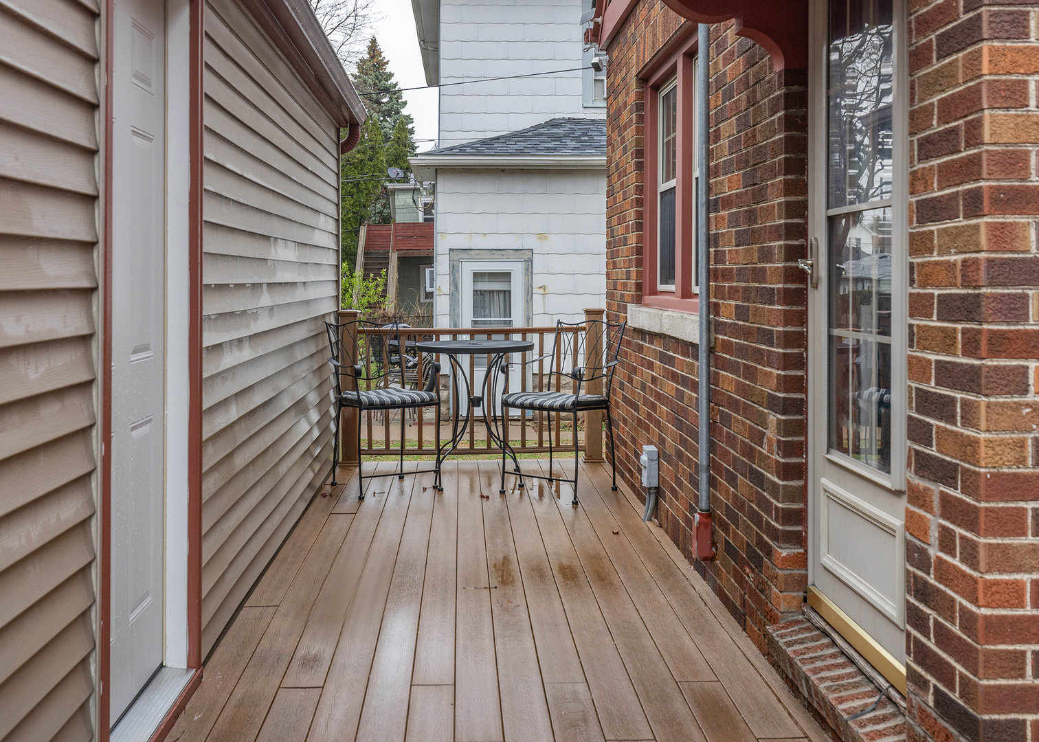 1125 17th Avenue Moline, IL 61265 - Photo 4 of 33 a view of balcony with wooden floor and bench