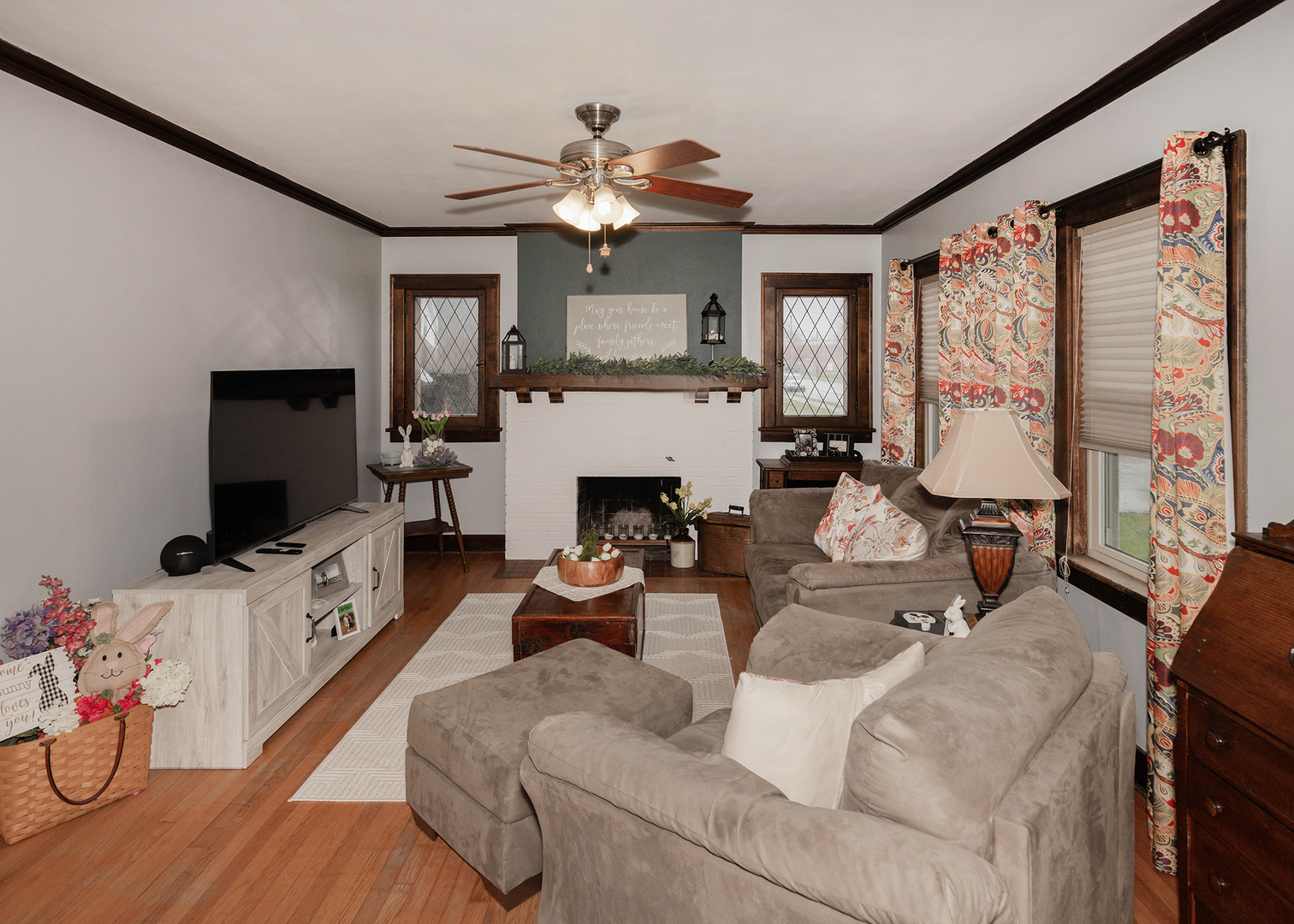 1125 17th Avenue Moline, IL 61265 - Photo 6 of 33 a living room with furniture a flat screen tv and a fireplace