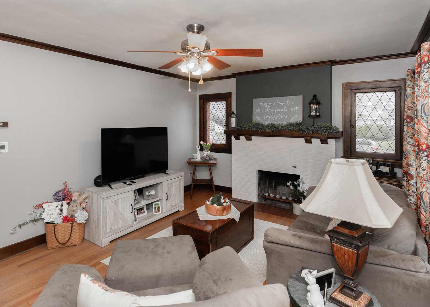 1125 17th Avenue Moline, IL 61265 - Photo 9 of 33 a living room with furniture a flat screen tv and a fireplace