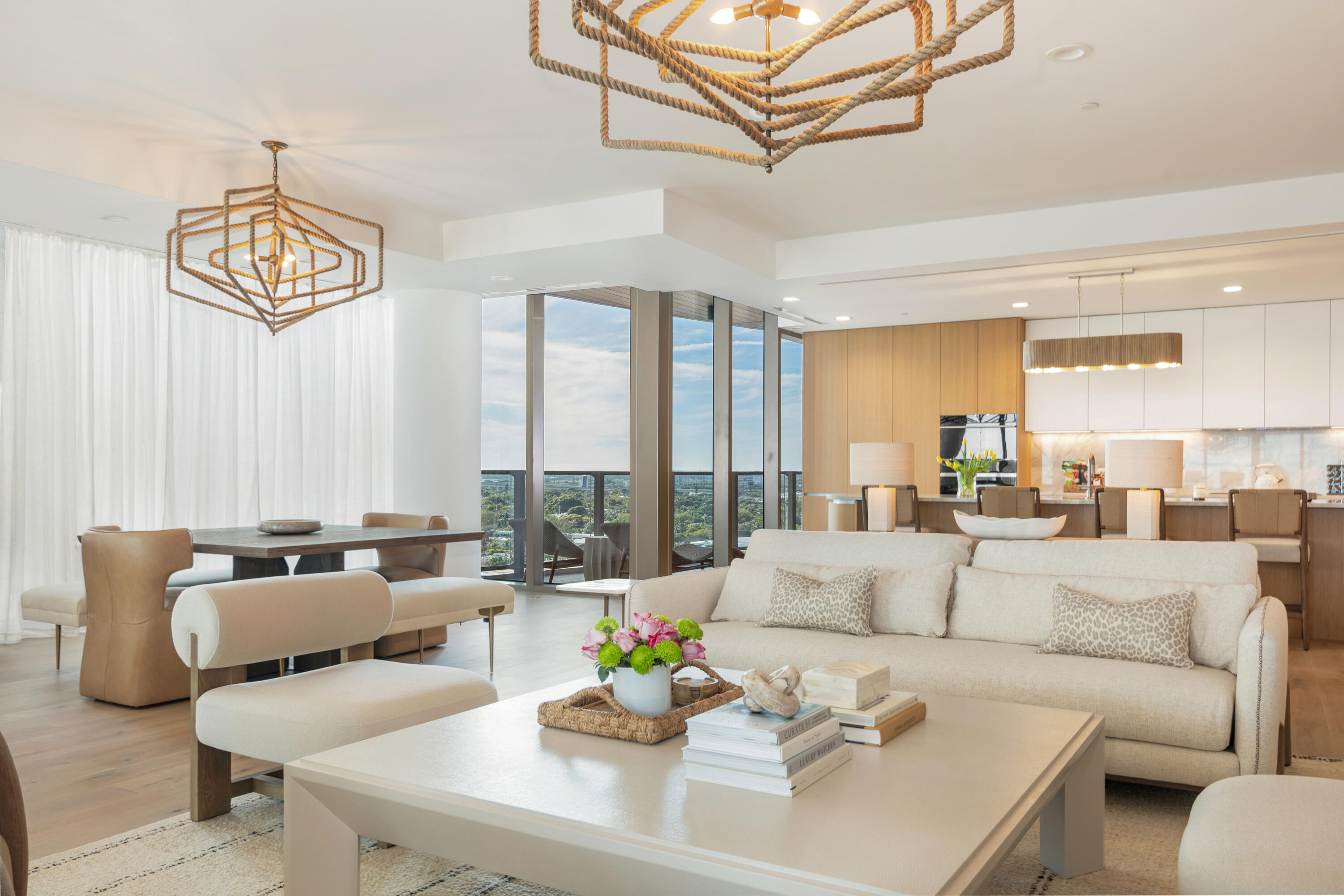 1333 South Flagler Drive, Unit 1202 West Palm Beach, FL 33401 - Photo 18 of 42 a living room with furniture and a chandelier