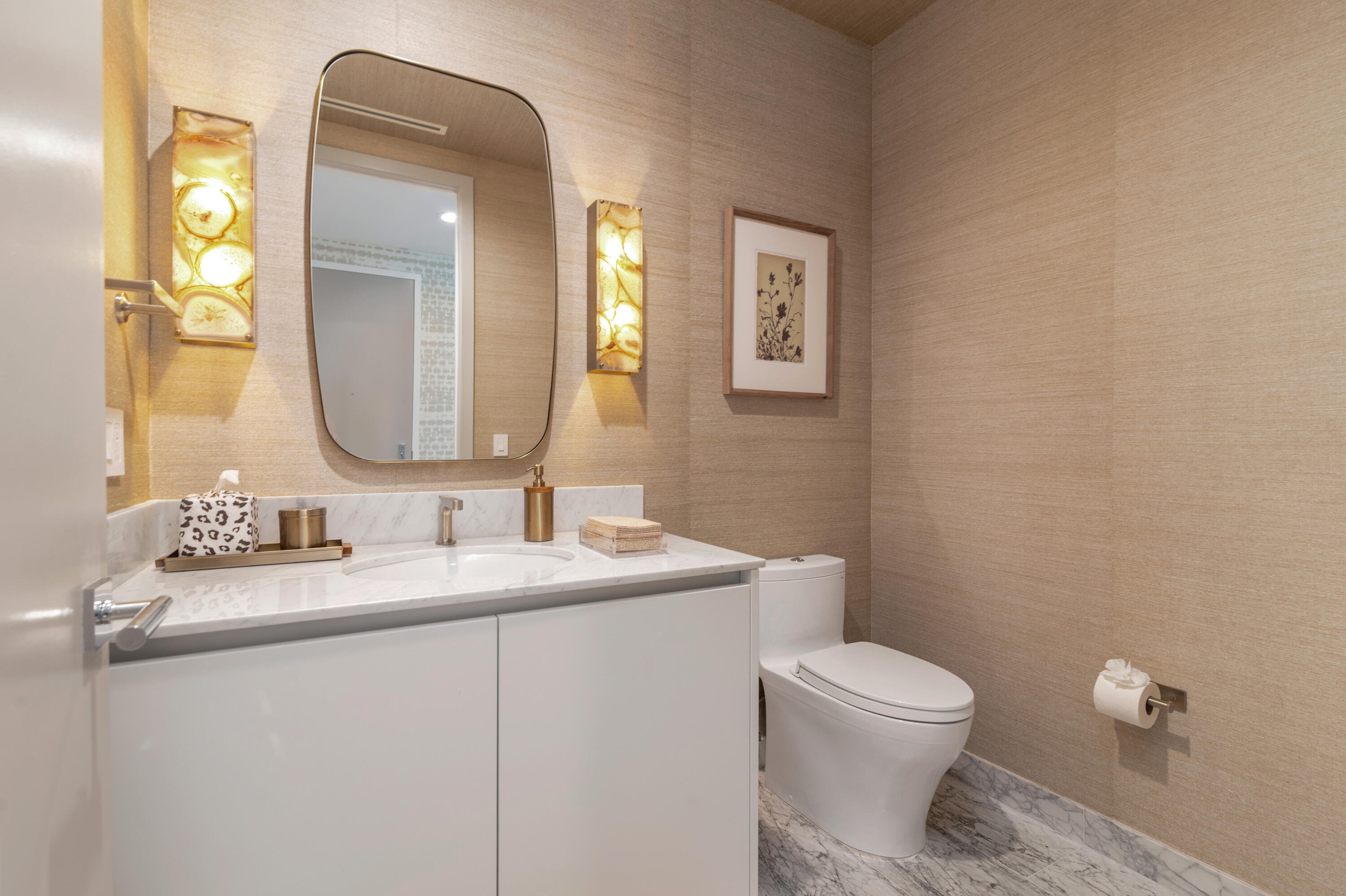 1333 South Flagler Drive, Unit 1202 West Palm Beach, FL 33401 - Photo 20 of 42 a bathroom with a toilet a sink a mirror and a window