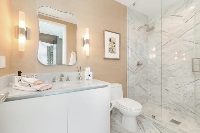 a bedroom with a large bed and a large window