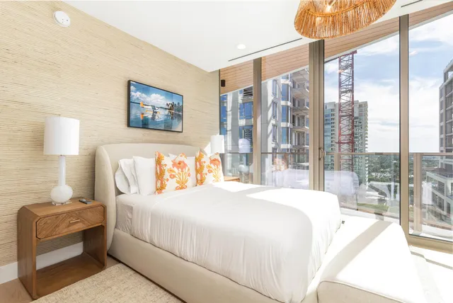 a bathroom with a sink vanity mirror and toilet