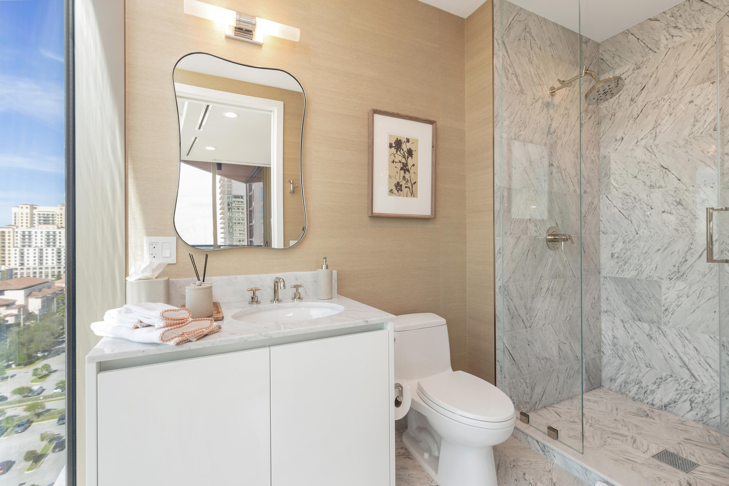 1333 South Flagler Drive, Unit 1202 West Palm Beach, FL 33401 - Photo 26 of 42 a bathroom with a sink toilet and shower