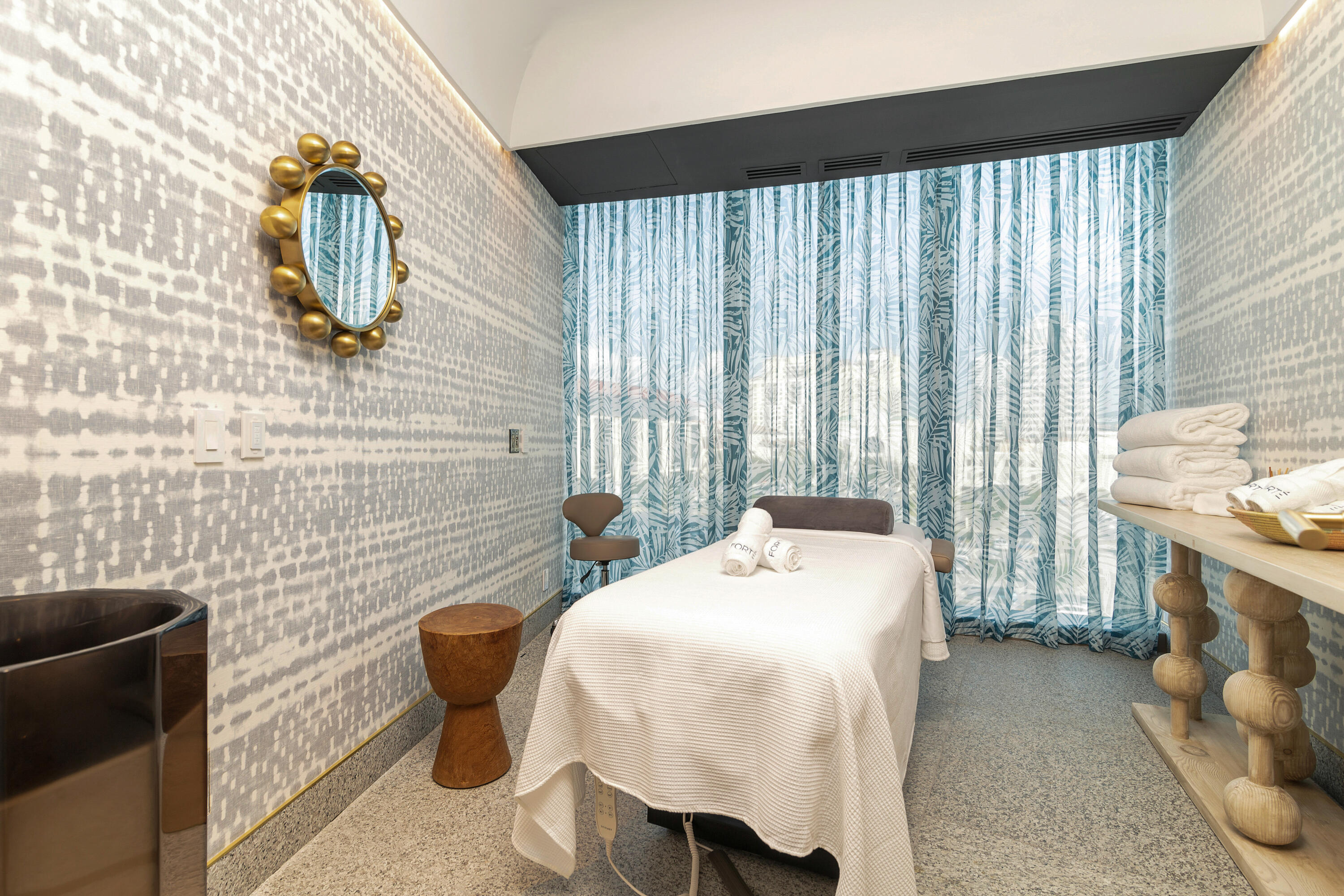 1333 South Flagler Drive, Unit 1202 West Palm Beach, FL 33401 - Photo 40 of 42 a bedroom with a bed and a mirror