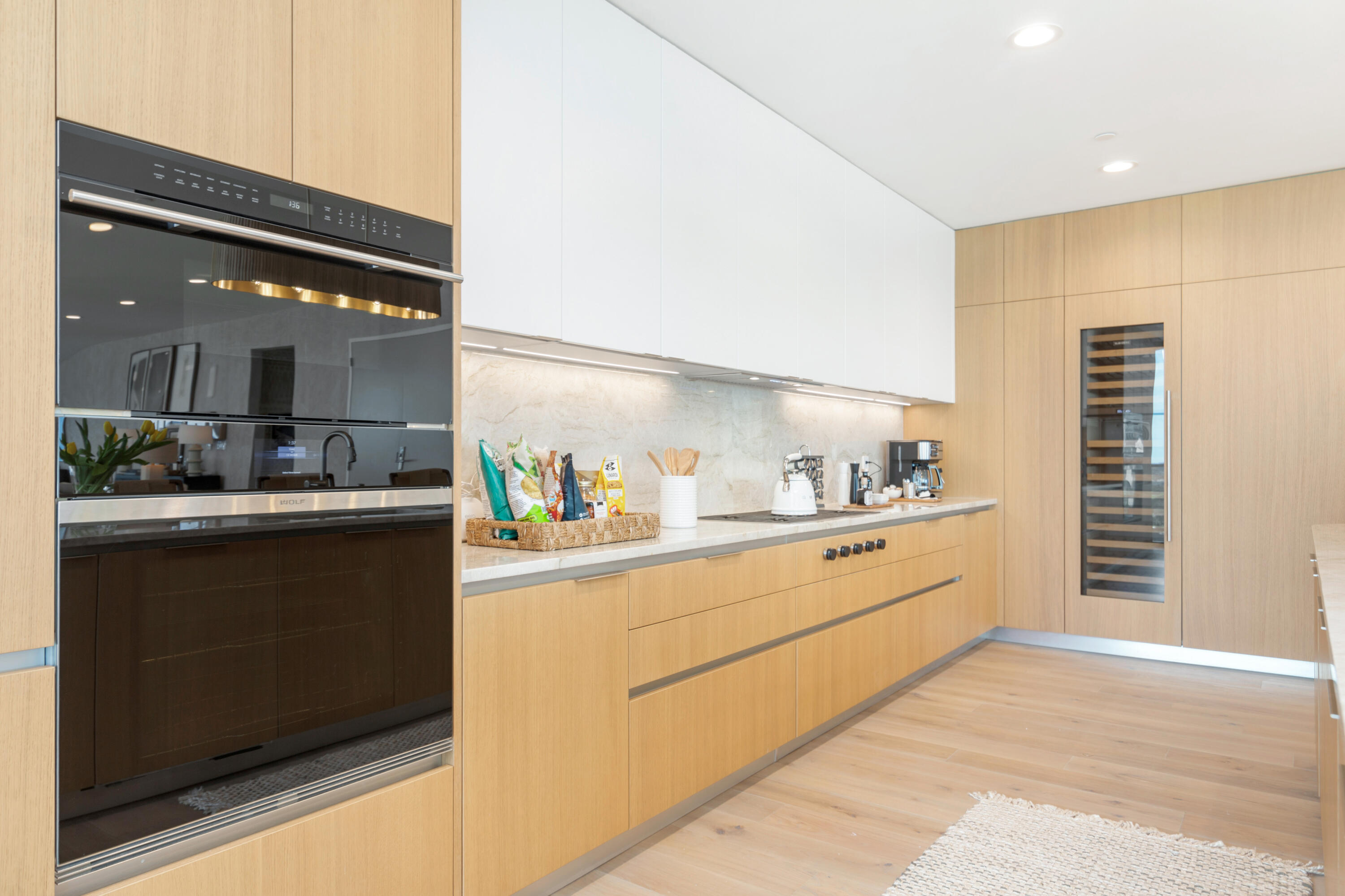 1333 South Flagler Drive, Unit 1202 West Palm Beach, FL 33401 - Photo 5 of 42 a kitchen with granite countertop white cabinets and white appliances