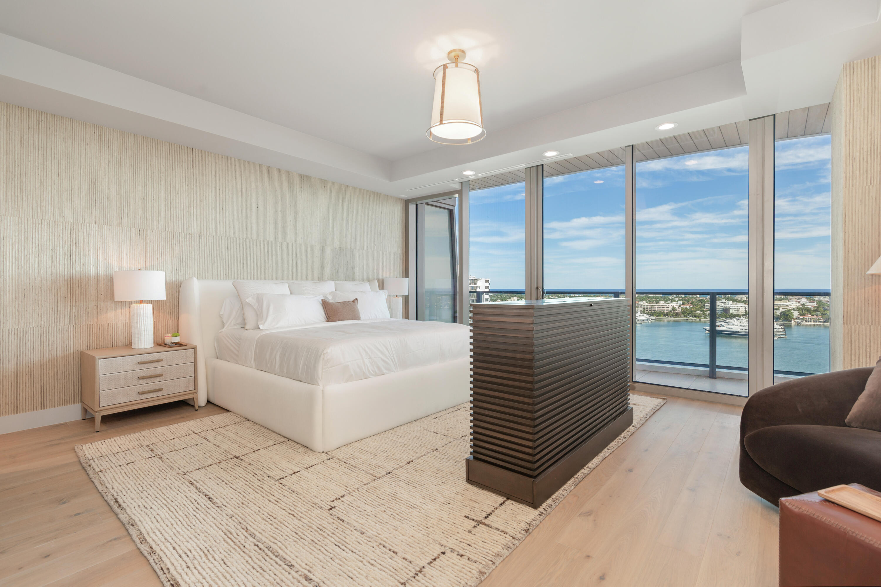 1333 South Flagler Drive, Unit 1202 West Palm Beach, FL 33401 - Photo 6 of 42 a bedroom with a large bed and a couch