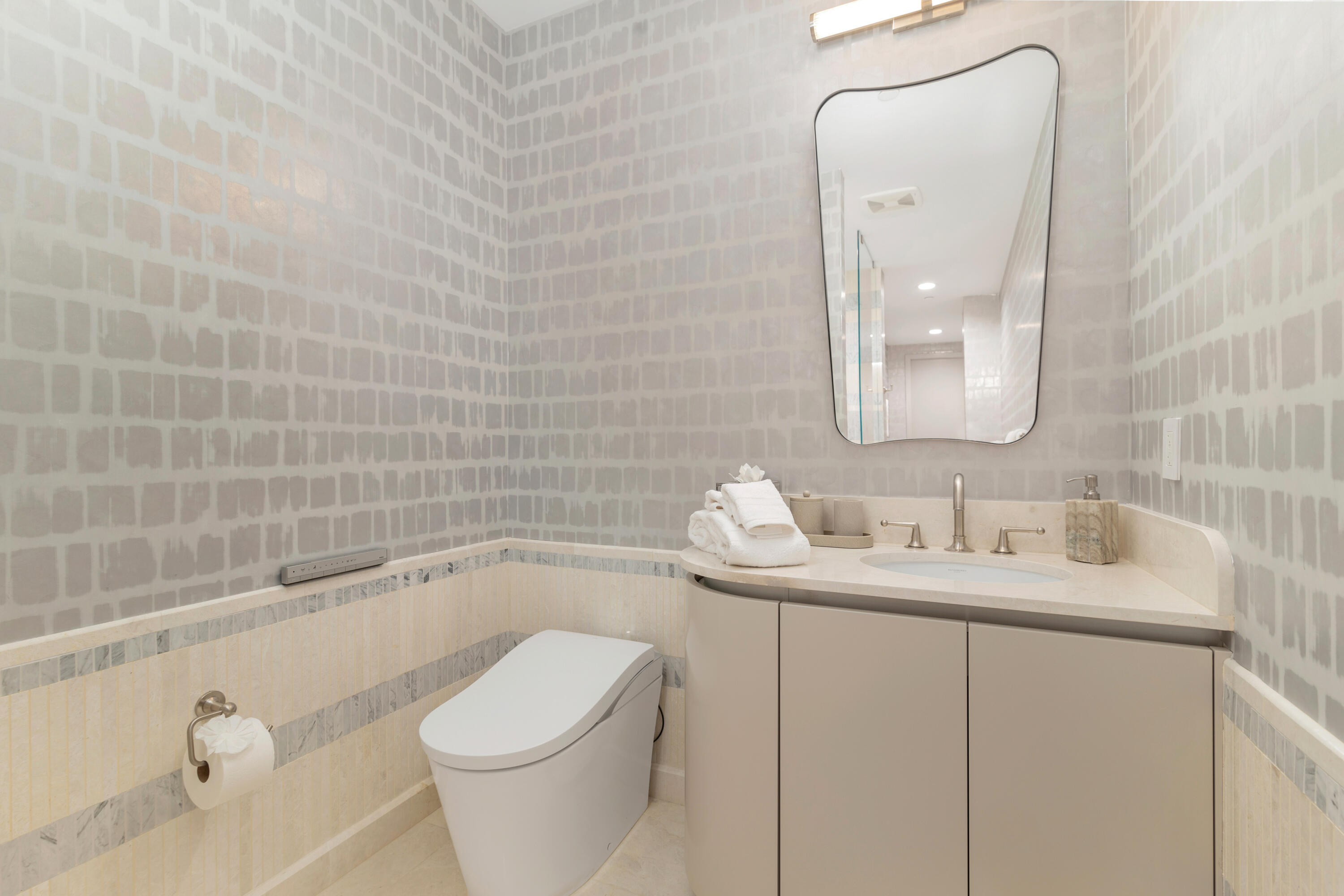 1333 South Flagler Drive, Unit 1202 West Palm Beach, FL 33401 - Photo 9 of 42 a bathroom with a granite countertop sink a toilet and bathtub