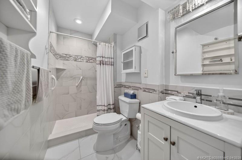 5323 Southeast Miles Grant Road, Unit 101 Stuart, FL 34997 - Photo 15 of 24 MASTER BATH