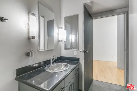 a bathroom with a sink and a mirror