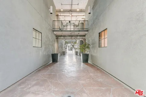 a view of entryway and hall with chandelier