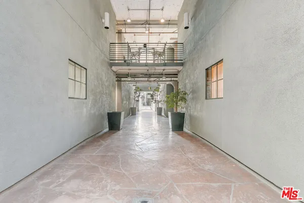 a view of entryway and hall with chandelier