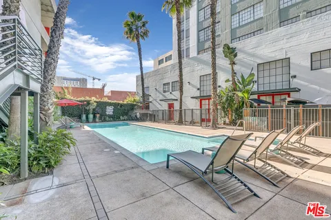 a view of a patio with a table and chairs