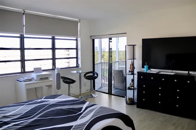 a bathroom with a sink mirror vanity and toilet