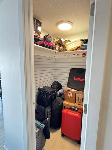 a view of a workspace with furniture and window