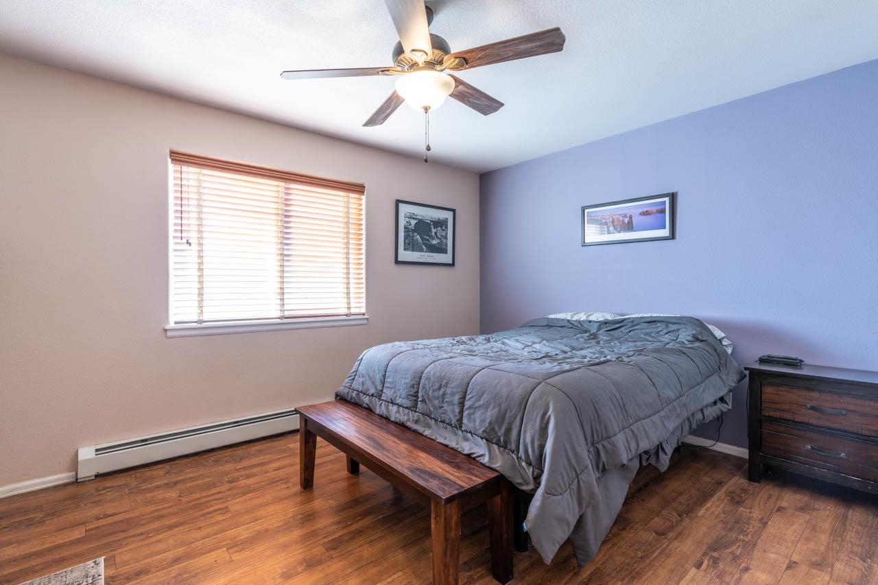 1458 Powell Street Fruita, CO 81521 - Photo 11 of 27 a bedroom with a bed and a window