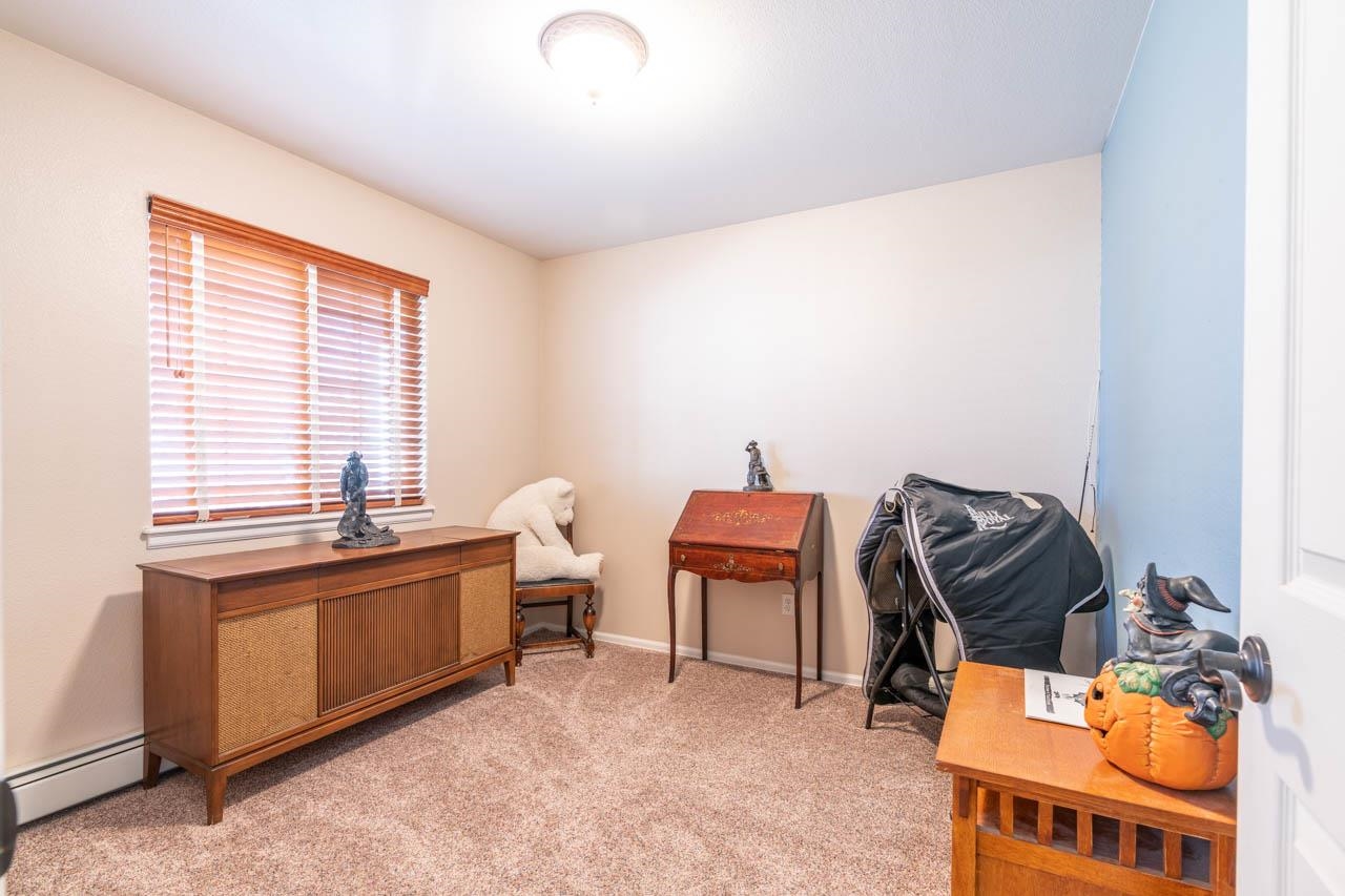 1458 Powell Street Fruita, CO 81521 - Photo 17 of 27 a view of a workspace with furniture and a window